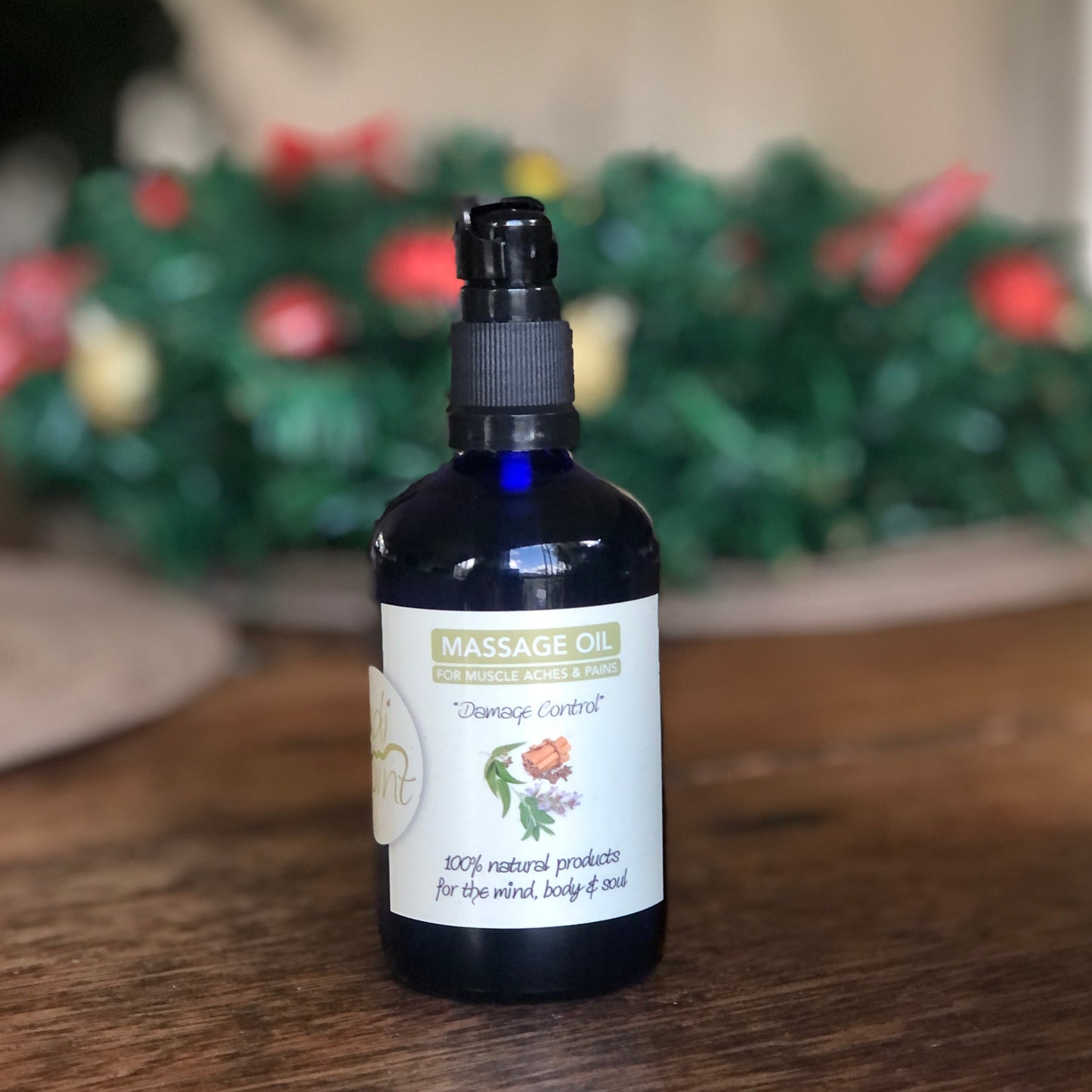 Bottle of massage oil on a wooden surface with a blurred background