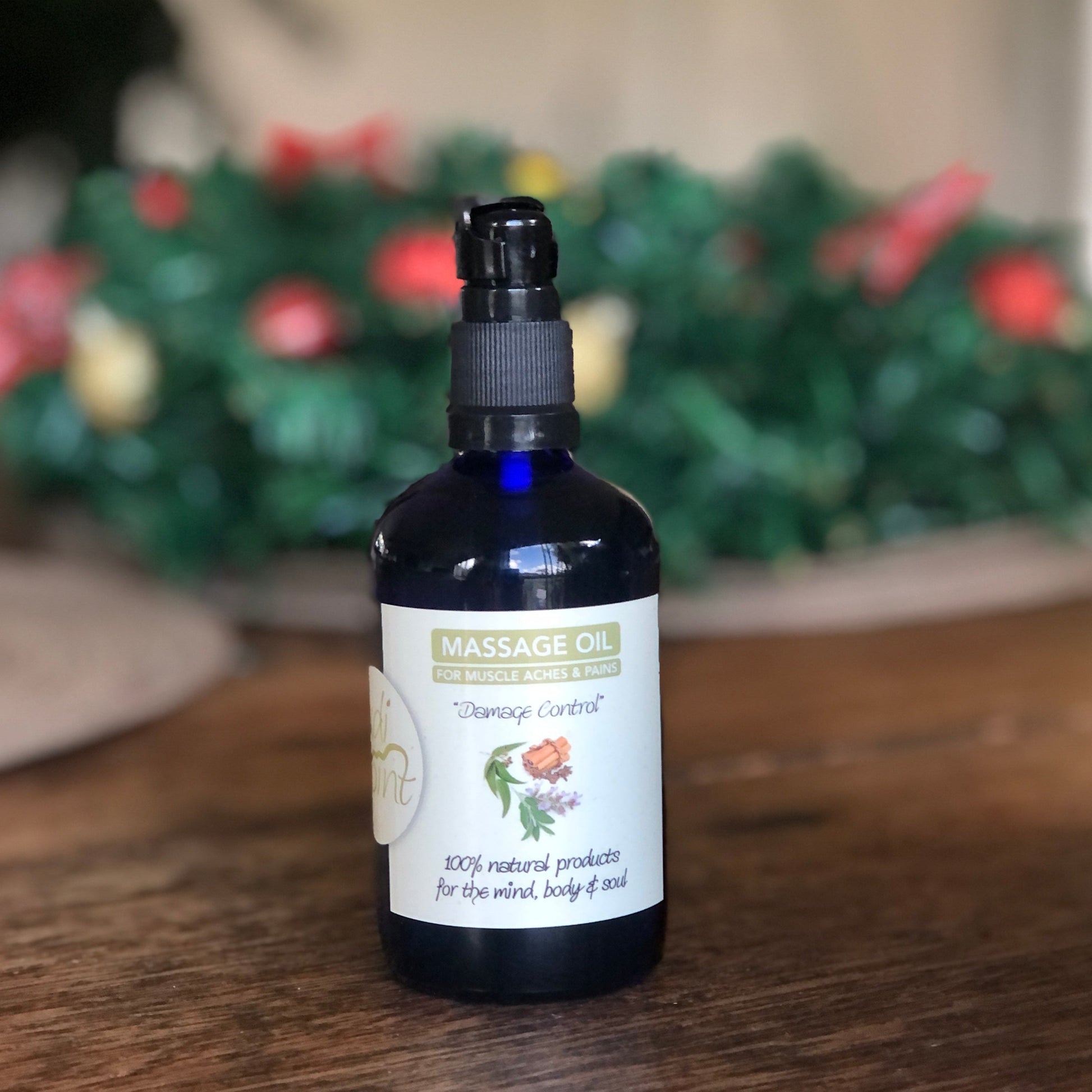 Bottle of massage oil on a wooden surface with a blurred background