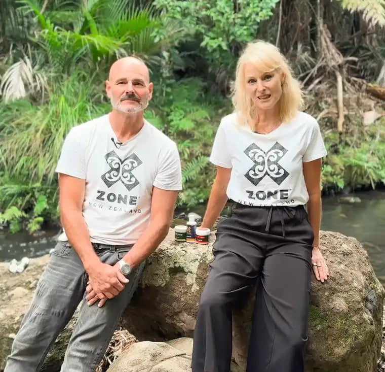 White t-shirt with black ’zone new zealand’ logo and maori-style tribal design